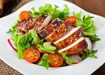 Fresh vegetable salad with grilled chicken breast