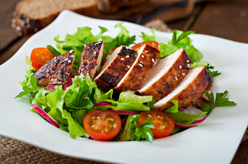 Fresh vegetable salad with grilled chicken breast