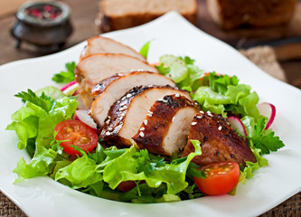 Fresh vegetable salad with grilled chicken breast