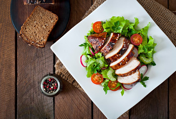 Fresh vegetable salad with grilled chicken breast