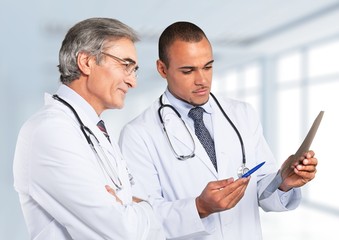 Fototapeta premium Doctor. Serious doctor with touchpad.