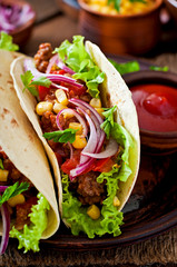 Mexican tacos with meat, vegetables and red onion