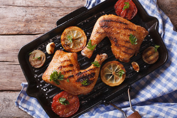 Chicken legs grilled on a grill pan close-up horizontal top view