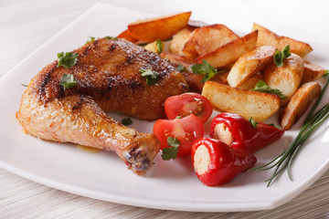 Grilled chicken leg, potatoes and vegetables, horizontal
