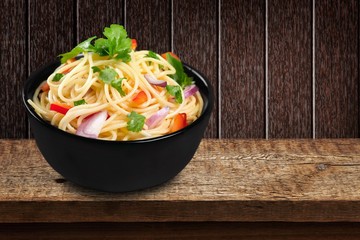 Spaghetti. Pasta in a white bowl with tomato sauce and fresh