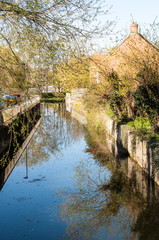 Fototapeta na wymiar Narrow river in rural English town, Suffolk
