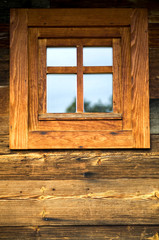 Obraz na płótnie Canvas Wooden window at wooden wall