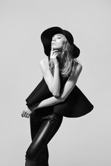 Fashion woman model in black dress - 82504586