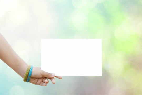 Hand Holds A Sign For The  Welcome