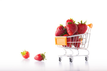 Orange metal shopping cart and strawberries.