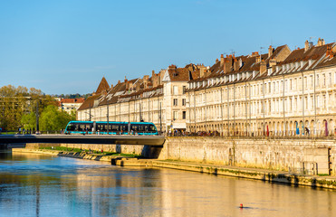 Naklejka premium View of embankment in Besancon with tram on a bridge - France