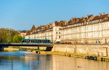 Wall murals View of embankment in Besancon with tram on a bridge - France