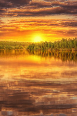 Sunset on the shore of beautiful lake