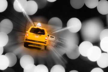 NYC yellow taxi with lights in tunnel