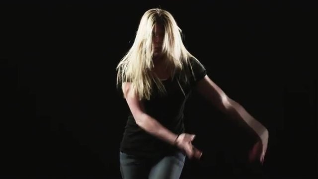 MS Young woman dancing against black background / Orem, Utah, USA