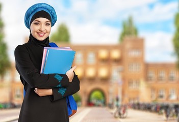 Arabic. Beautiful female middle eastern college student in front
