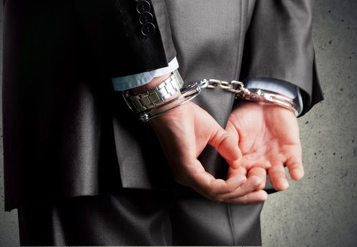 Handcuffs. Corporate crime