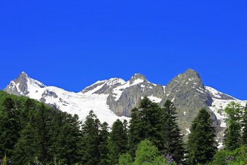 Caucasus Mountains Under Snow And Clear Blue Sky