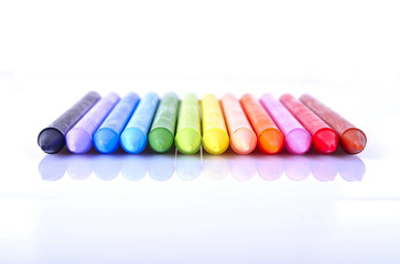 Colored pencils on white background