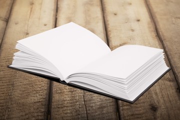 Architect. Opened book and hand drawing building sketches