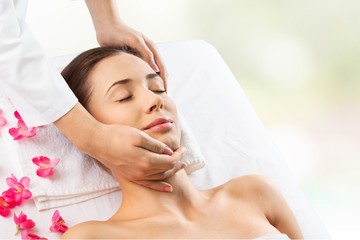 Obraz na płótnie Canvas Aromatherapy. Beautiful young woman enjoy face massage at spa