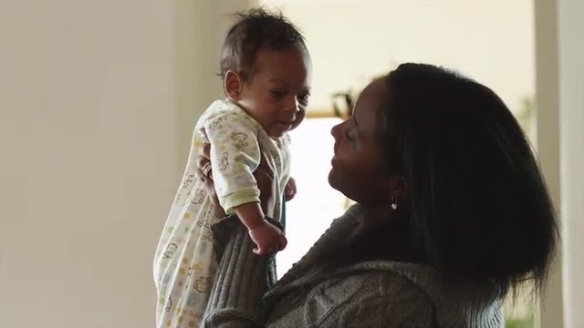MS Woman holding baby boy (2-5 months) indoors / Cedar Hills, Utah, USA