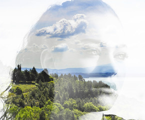 Double exposure of girl portrait and landscape