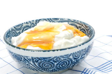 Greek yogurt with honey in a pot