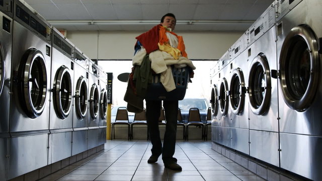 young man at the laundromat