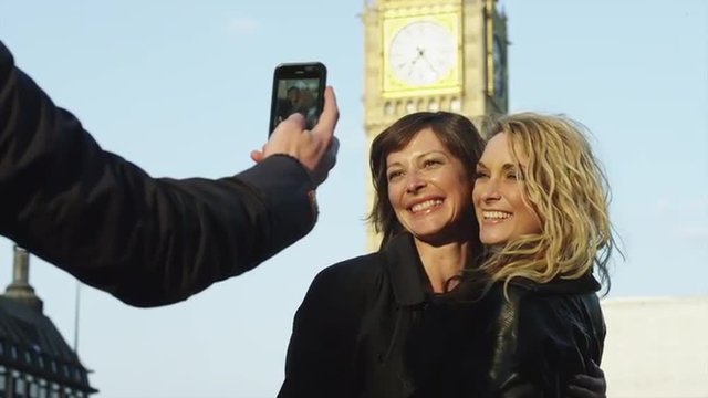 MS Friends taking self photo in front of Big Ben / London, UK