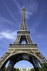 Eiffel Tower paris france low view looking up upwards blue sky background trocadero in the distance photo vertical