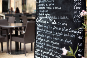 Paris France French restaurant with menu board and customer seating in the background photo © david_franklin