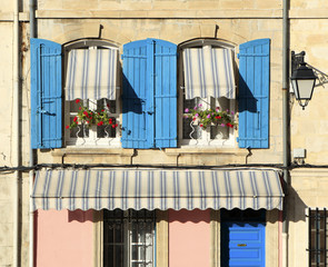 Typical French window scene in Arles Provence France with blue shutters country village photo