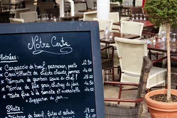 Photo sur Plexiglas Restaurant Menu board outside a street cafe retaurant entrance Paris France French restaurant photo