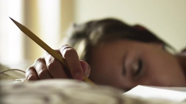 CU R/F Teenage (16-17) sleeping with pencil in hand, American Fork, Utah, USA