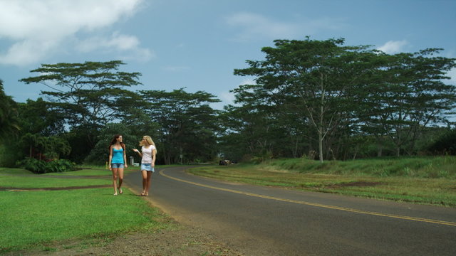 two young women checking out a runner