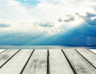 Background. Wood, blue sea and sky background