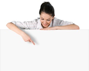 Women. Close-up of a young woman leaning on billboard