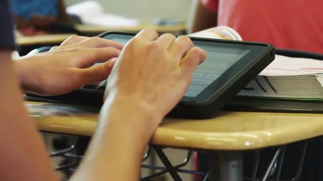CU DS Student using tablet computer during classes / Spanish Fork City, Utah, USA