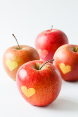 Red apples with a heart symbol