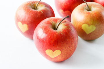 Red apples with a heart symbol