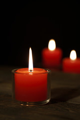 Obraz na płótnie Canvas Hope illuminatesThree candles on the old wooden table