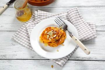 Fritters with honey on a plate