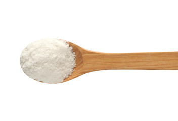 Wooden spoon with salt.