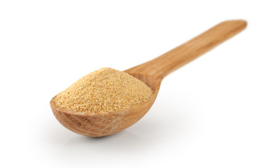 Wooden spoon with dried garlic.