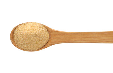 Wooden spoon with dried garlic.