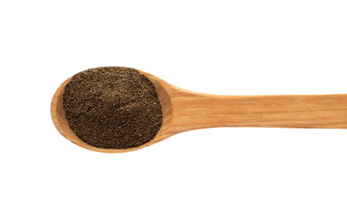 Spoon with pepper on a white background