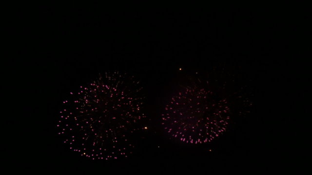 4K variation of colorful fireworks in summer skies.