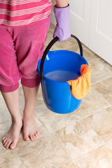 Image with woman holding a bucket with water for cleaning