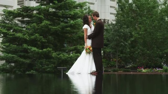 WS TU Bride and groom kissing by pond / Salt Lake City, Utah, USA